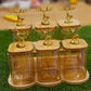 6-Piece Amber Glass Canister Set with Bamboo Tray and Gold Deer Lids