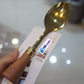 Golden Serving Spoon With Wooden Handel