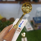 Golden Serving Spoon With Wooden Handel